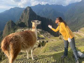 Small group tour exploring Machu Picchu with The Traveling Professor overlooking the Andes Mountains